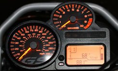 The Beemer’s panel is almost rudimentary next to the Ducati’s. However, at a glance, the GS’ analog gauges require less brain processing power.